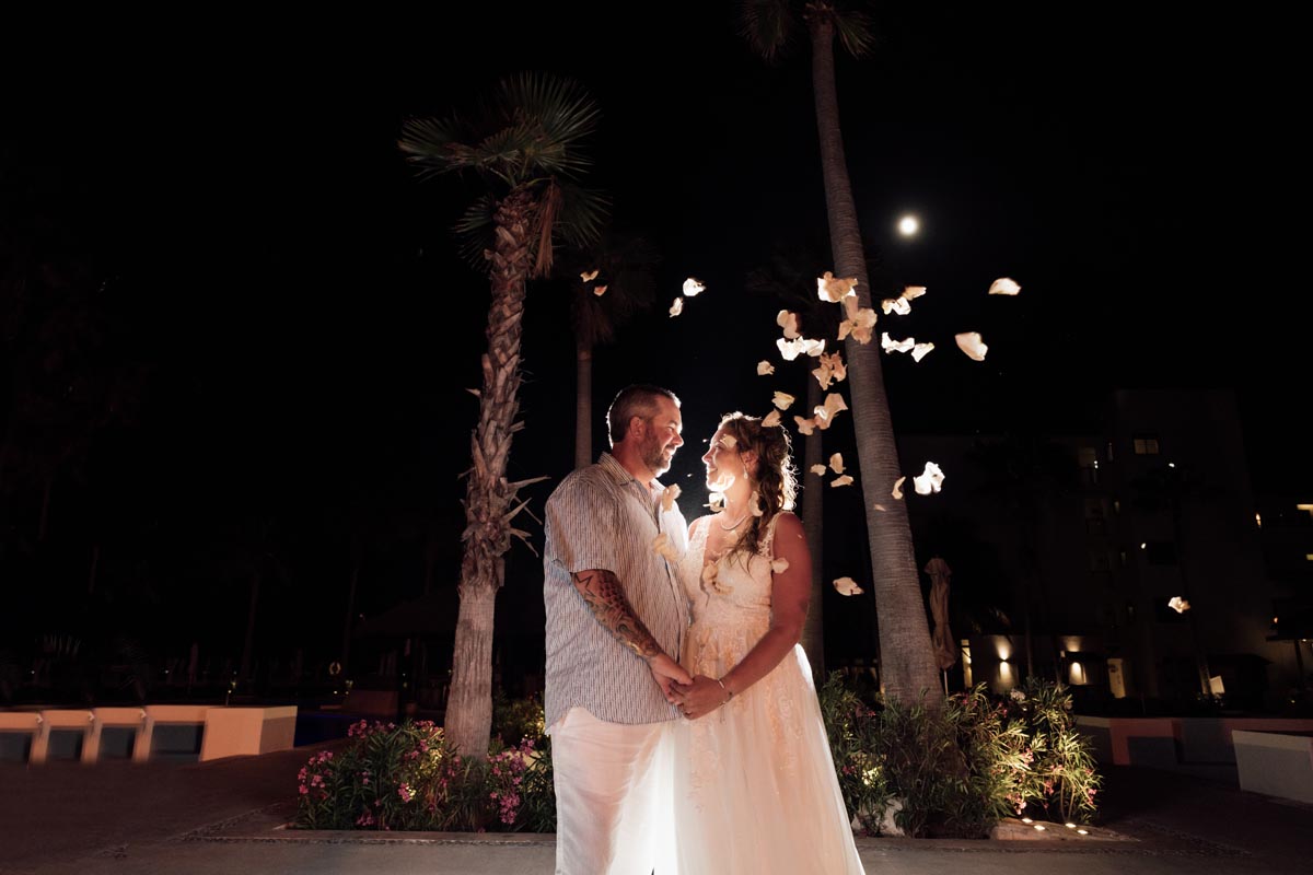 Newlyweds dance under floating confetti