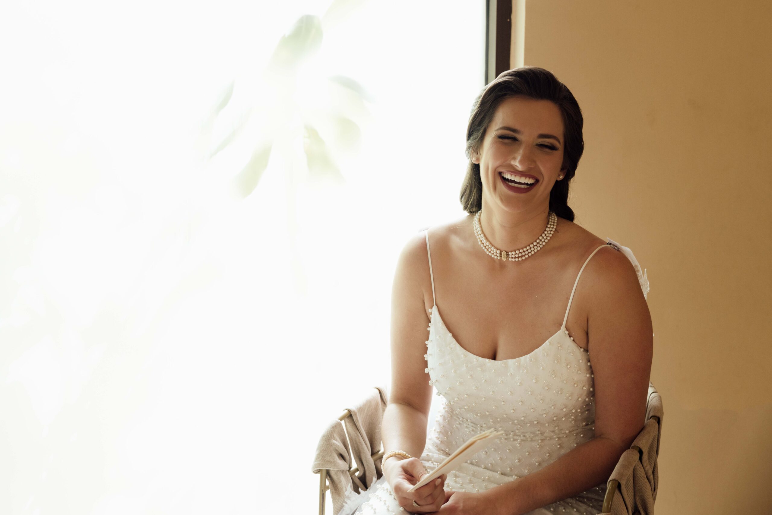 Happy Bride holds letter from her groom